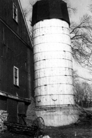 silo alongside barn